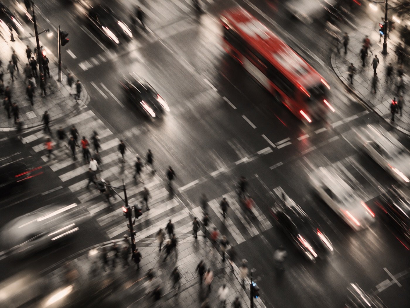 Busy city intersection at rush hour, blurred with motion